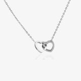 Silver double-heart necklace, engraved with a sample name.