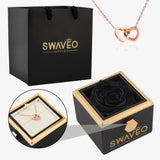 Senvoa black gift bag, black box with black rose, and rose gold heart necklace engraved with names.